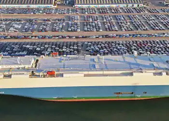 YANTAI, CHINA - MARCH 30: Aerial view of vehicles waiting to be loaded onto a ro-ro ship for export at Yantai Port on March 30, 2025 in Yantai, Shandong Province of China. (Photo by Sun Wentan/VCG via Getty Images)